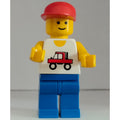 fig-000128 – Man, White Vest with Truck, Blue Legs, Red Cap (3626a Head)