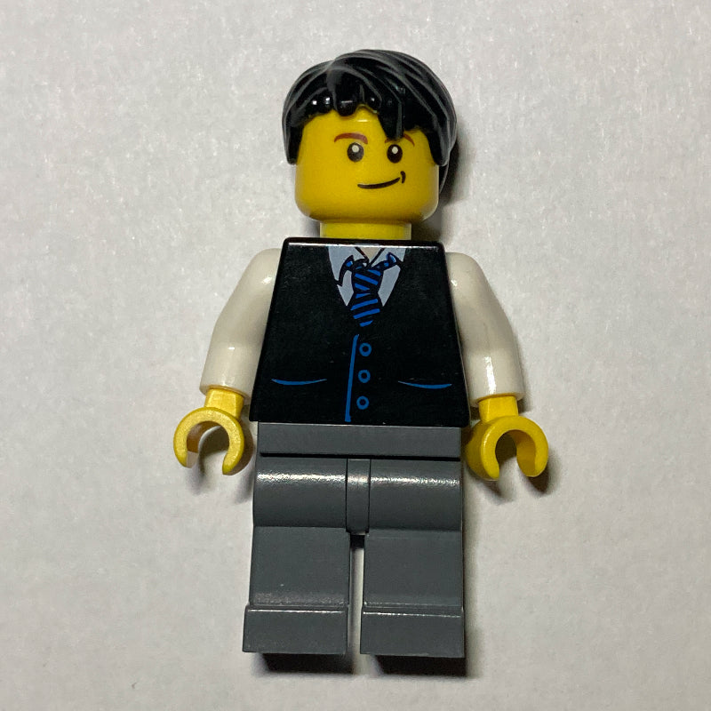 fig-000182 – Man, Black Vest and Tie, Dark Bluish Gray Legs, Black Hair