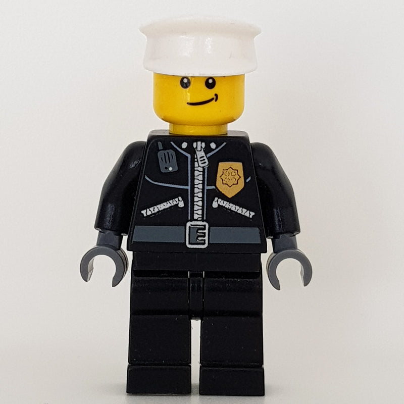 fig-000243 – Policeman, Black Jacket with Zipper, Radio, Badge, and 'POLICE' on Back, White Hat