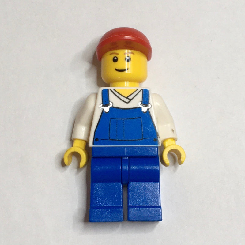 fig-000633 – Man, Blue Overalls over White V-Neck Shirt, Red Cap, Brown Eyebrows