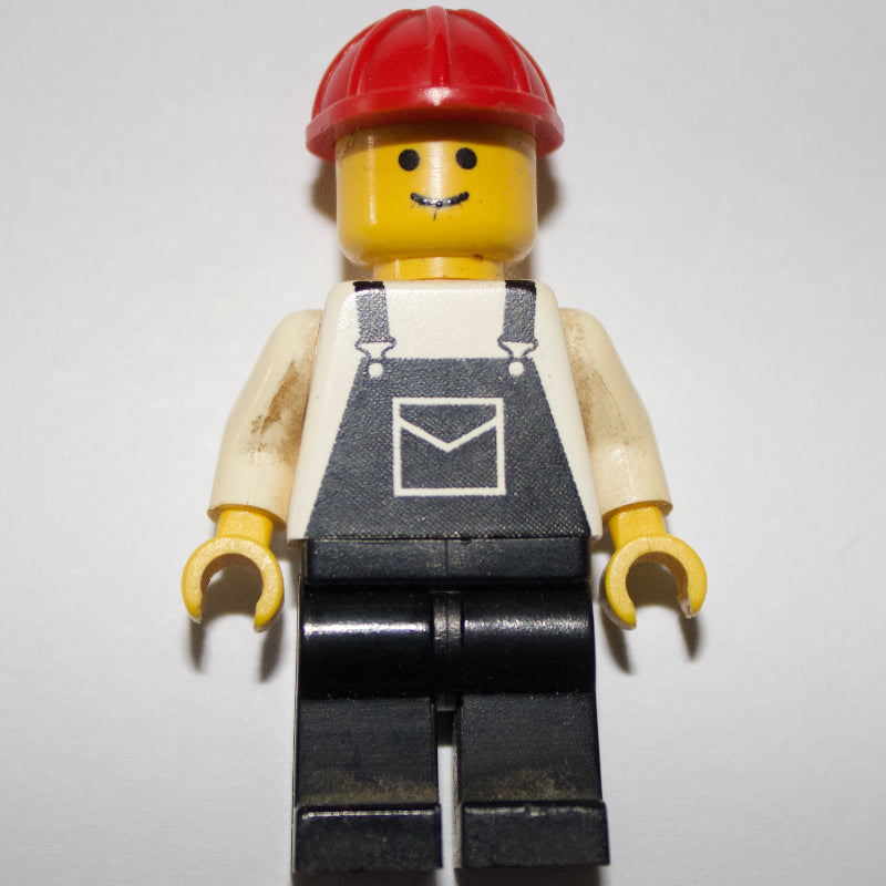 fig-000675 – Man, Black Overalls, Red Hard Hat (3626a Head)