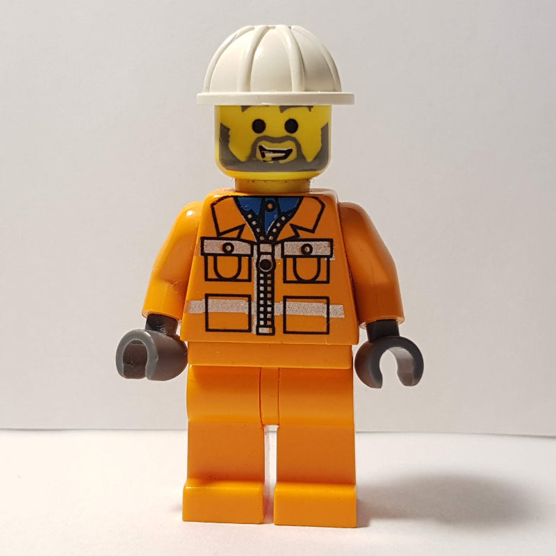 fig-000692 – Garry - Construction Worker, Orange Jacket with Zipper and Reflective Stripes, Orange Legs, White Hard Hat, Beard
