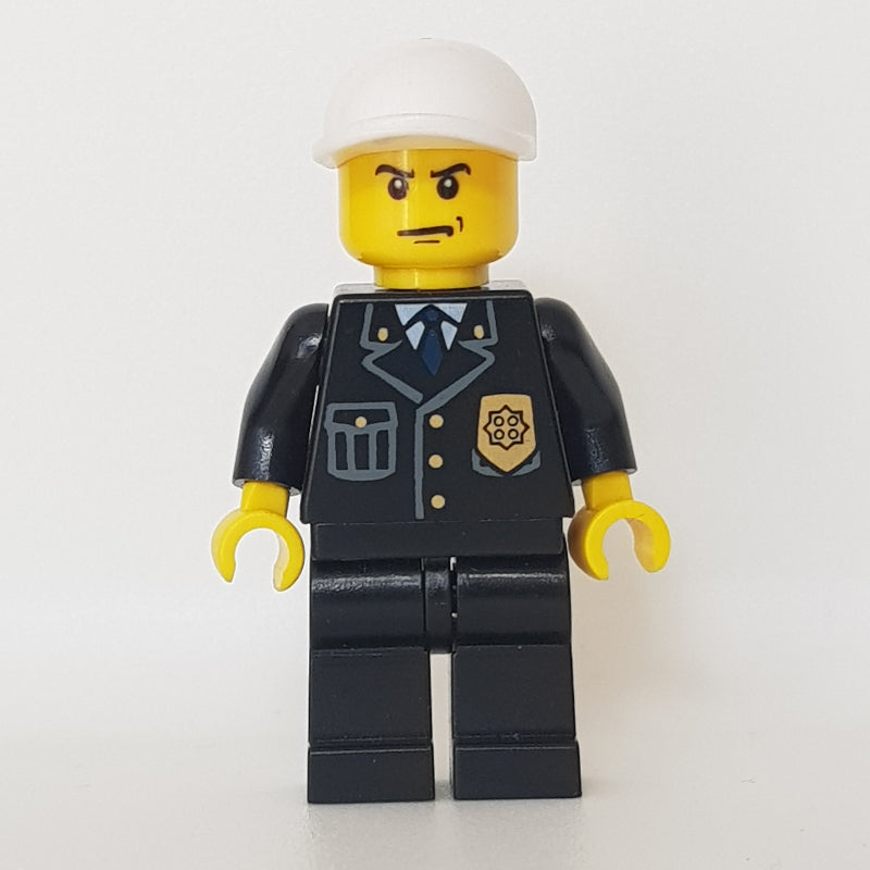 fig-000797 – Policeman, Black Jacket with Pocket and Badge, White Cap