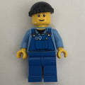 fig-000831 – Man, Blue Overalls over Shirt, Blue Legs, Black Hat, Reddish Brown Eyebrows