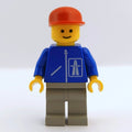 fig-001007 – Man, Blue Jacket with Highway Logo, Light Gray Legs, Red Cap