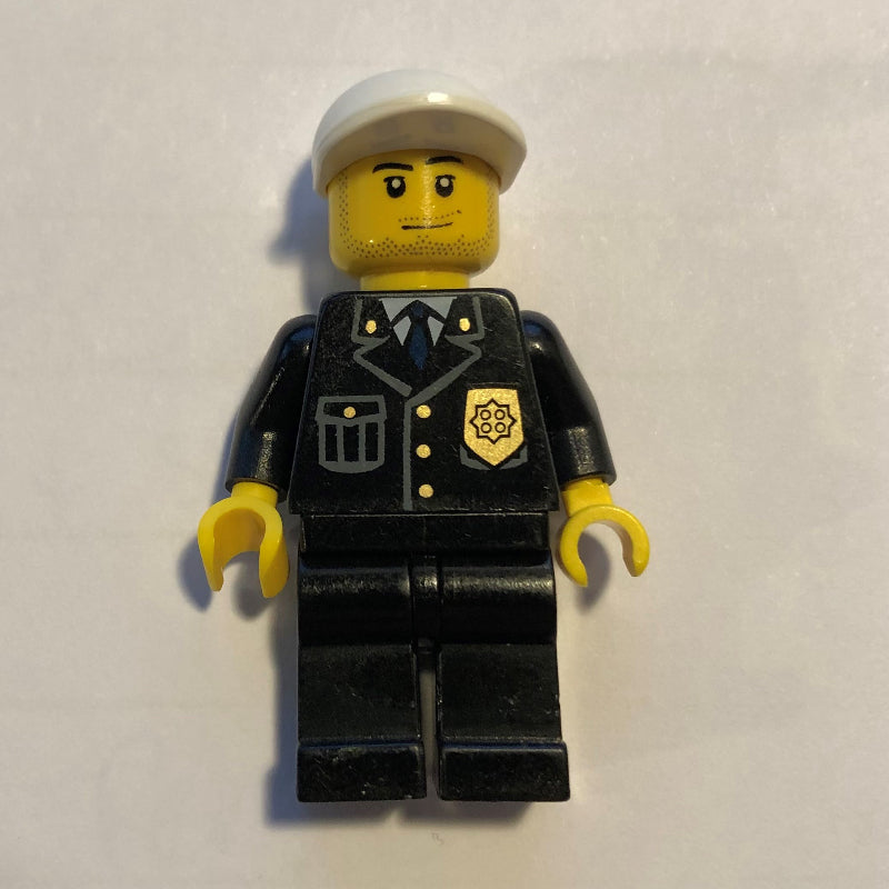 fig-001423 – Policeman, Black Suit with Badge, White Cap, Stubble