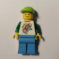 fig-001578 – Man, Floating Classic Spaceman on Shirt, Medium Azure Legs, Lime Cap