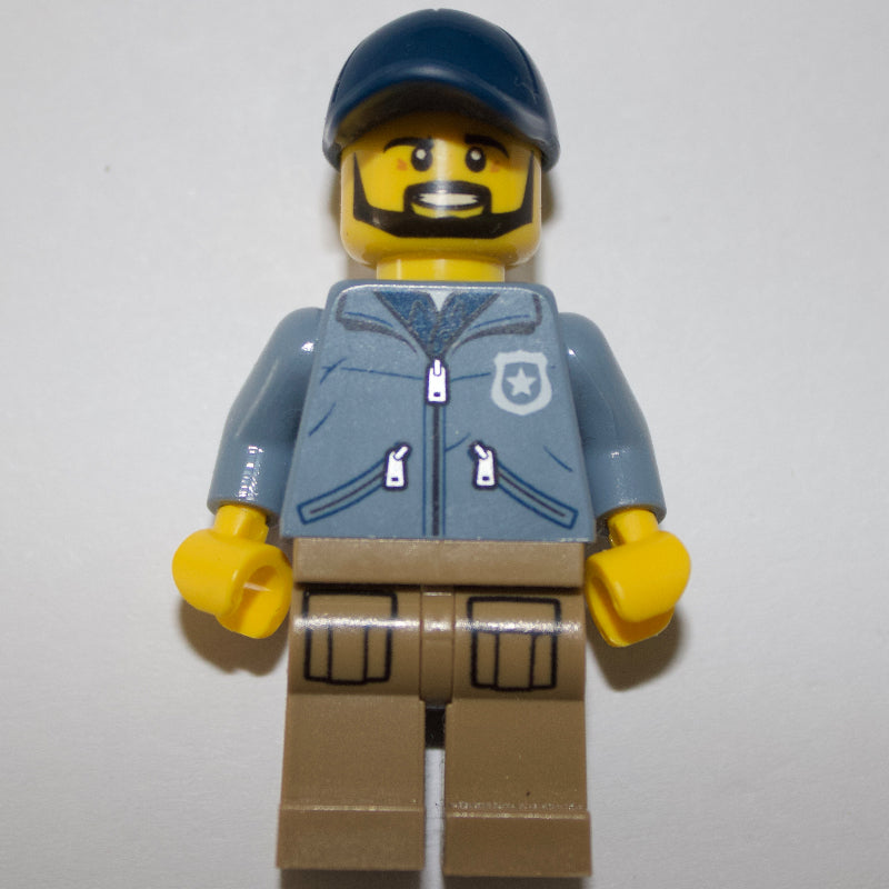 fig-001730 – Policeman, Sand Blue Jacket with Pockets and 'POLICE' on Back, Dark Blue Cap, Beard