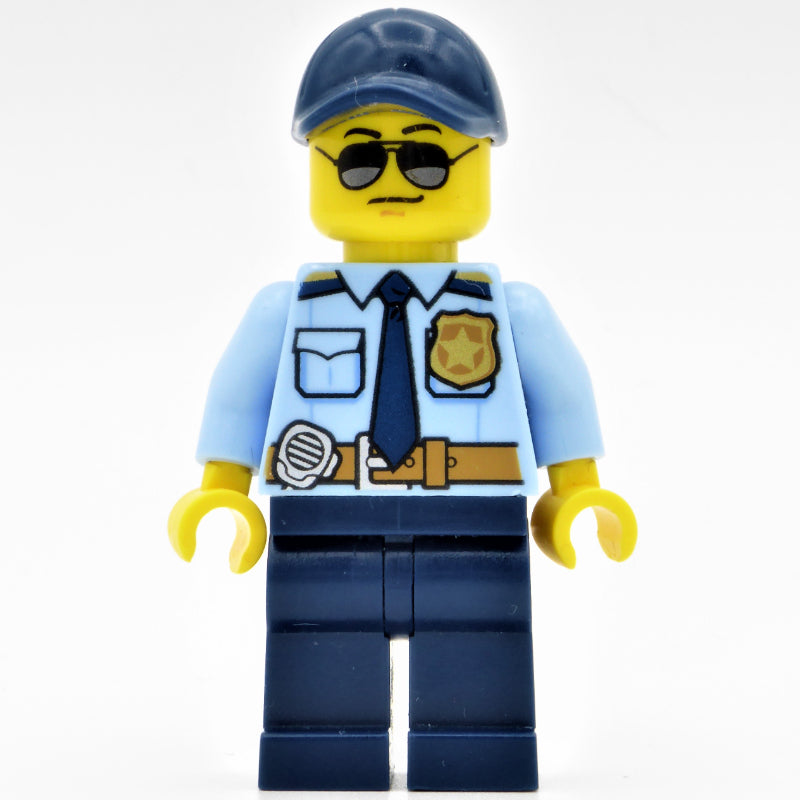 fig-001924 – Policeman, Bright Light Blue Shirt with Dark Blue Tie, Badge, and Radio on Belt, Dark Blue Cap, Sunglasses