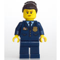 fig-003389 – Policewoman, Dark Blue Suit and Tie, Dark Brown Bun Hair