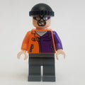 fig-004558 – Two-Face's Henchman in Orange and Purple Outfit with Glasses