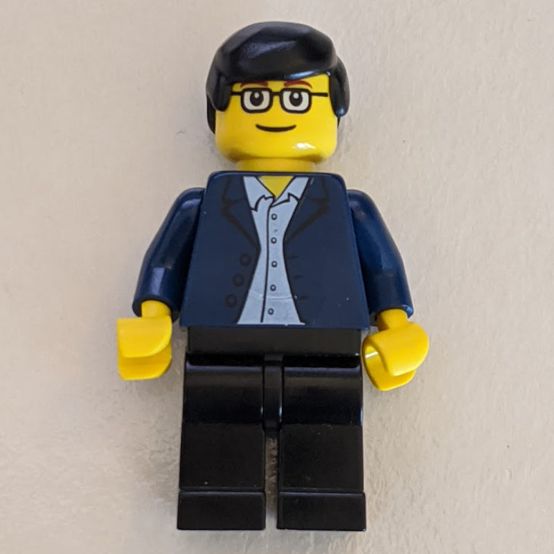 fig-004781 – Man - Dark Blue Jacket, Black Legs, Glasses