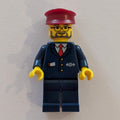 fig-004817 – Conductor - Dark Blue Jacket, Dark Blue Legs, Dark Red Hat, Glasses, Beard