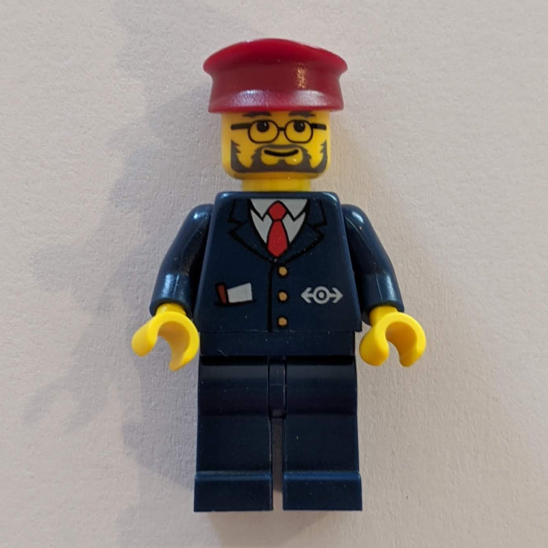 fig-004817 – Conductor - Dark Blue Jacket, Dark Blue Legs, Dark Red Hat, Glasses, Beard