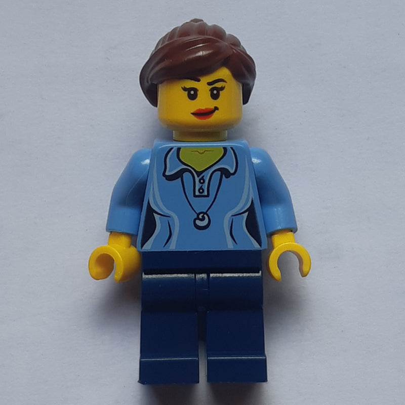 fig-006820 – Woman, Medium Blue Polo Shirt with Necklace, Dark Blue Legs, Reddish Brown Ponytail