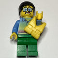 fig-007266 – Man, Sunset Shirt with Palm Trees, Green Legs, Yellow Life Vest, Glasses