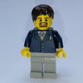 fig-007339 – Man, Dark Blue Pinstripe Suit with Gold Tie, Dark Brown Hair