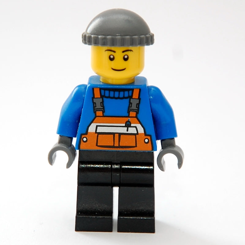 fig-007369 – Man, Orange Overalls over Blue Sweater, Black Legs, Dark Bluish Gray Hat, Brown Eyebrows