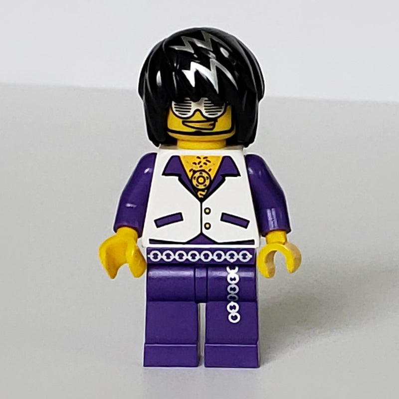 fig-007454 – Musician, Man, White Vest over Dark Purple Shirt, Black Hair with Silver Streaks, Glasses