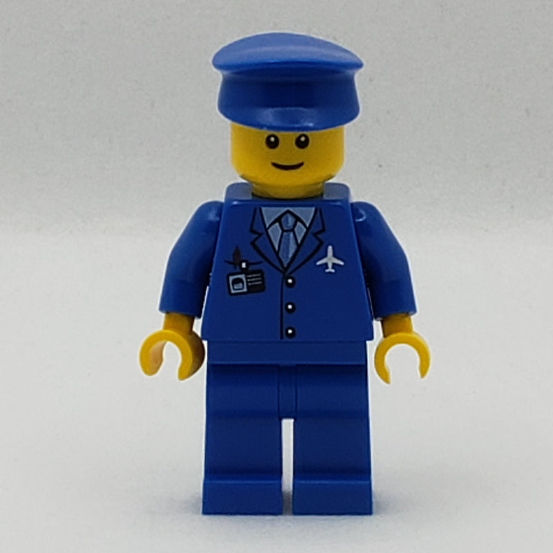 fig-007712 – Pilot, Blue Jacket with Plane Logo and Blue Tie, Blue Legs, Blue Hat, Smile, Reddish Brown Eyebrows