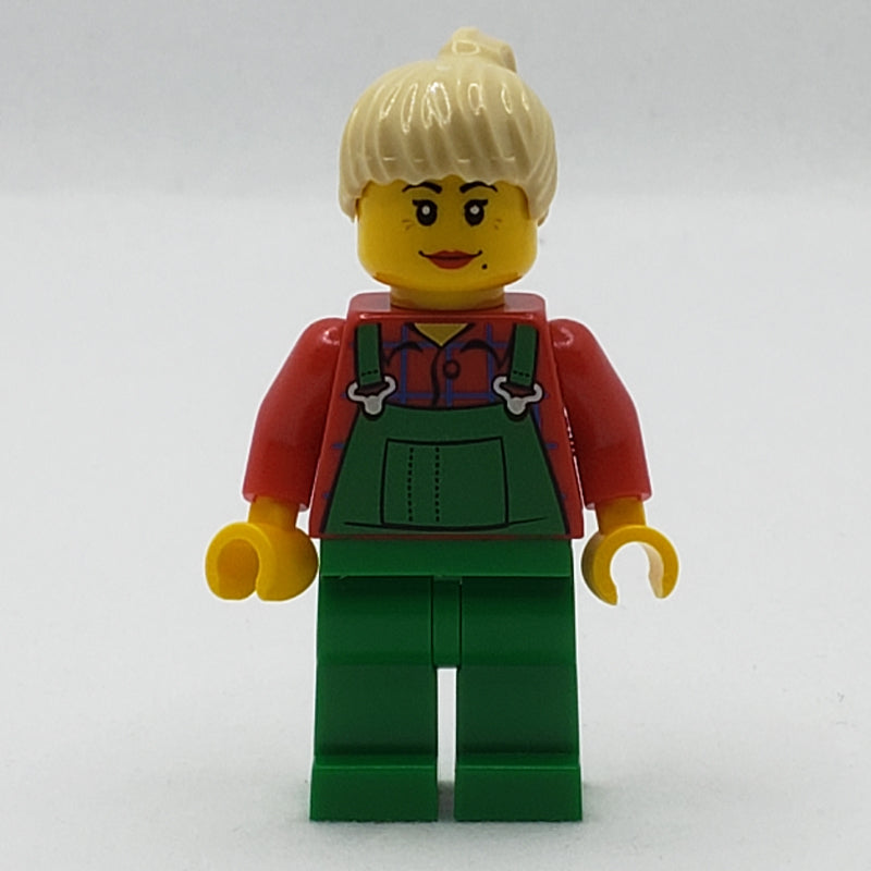 fig-007721 – Woman, Green Overalls over Red Plaid Shirt, Tan Ponytail