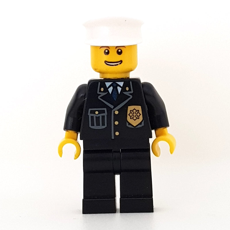 fig-007788 – Policeman, Black Jacket with Pocket and Badge, White Hat, Open Mouth