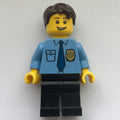 fig-007793 – Policeman, Medium Blue Shirt with Badge and Tie, Black Legs, Dark Brown Hair