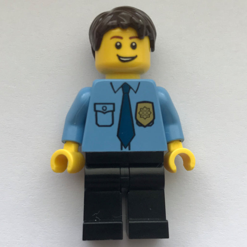 fig-007793 – Policeman, Medium Blue Shirt with Badge and Tie, Black Legs, Dark Brown Hair