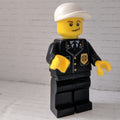 fig-007799 – Policeman, Black Suit with Badge, White Cap