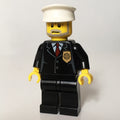 fig-007801 – Policeman, Black Suit with Badge, White Hat, Gray Beard