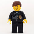 fig-007806 – Policeman, Black Suit with Badge, Reddish Brown Hair