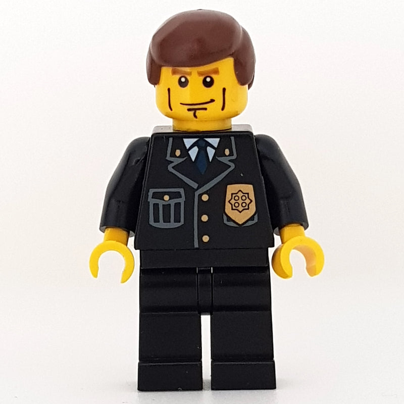 fig-007806 – Policeman, Black Suit with Badge, Reddish Brown Hair