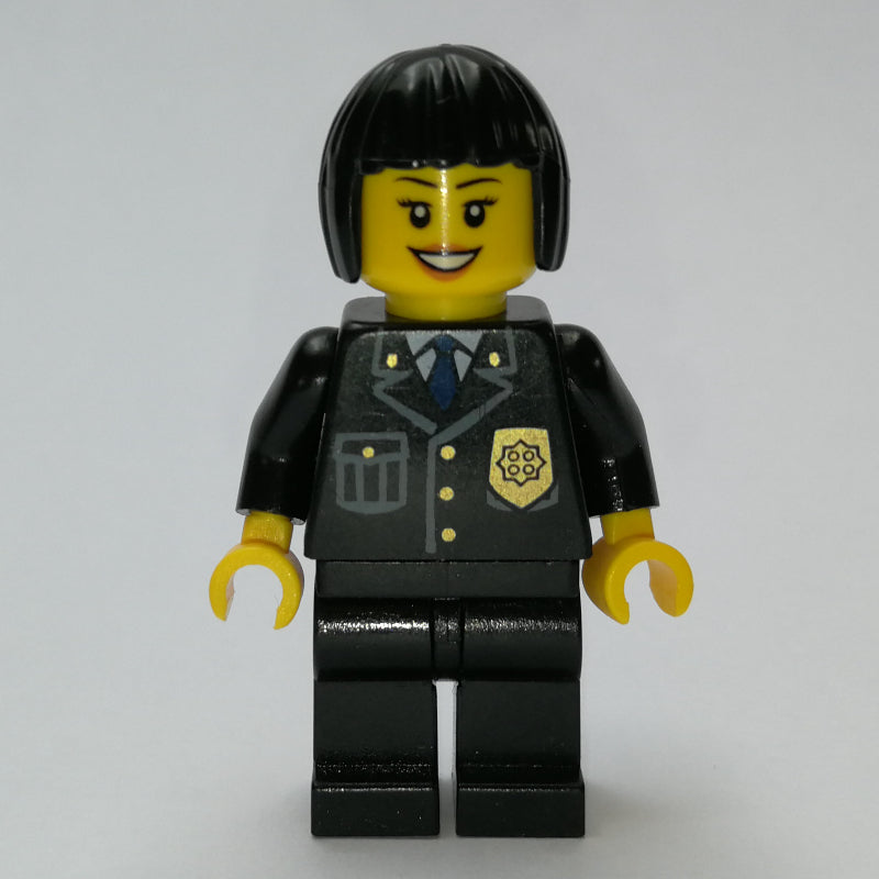 fig-007811 – Policewoman, Black Suit with Badge, Black Hair