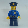 fig-007863 – Policeman, Blue Shirt with Badge and Pouches, Dark Blue Legs, Dark Blue Police Hat with Badge, Beard