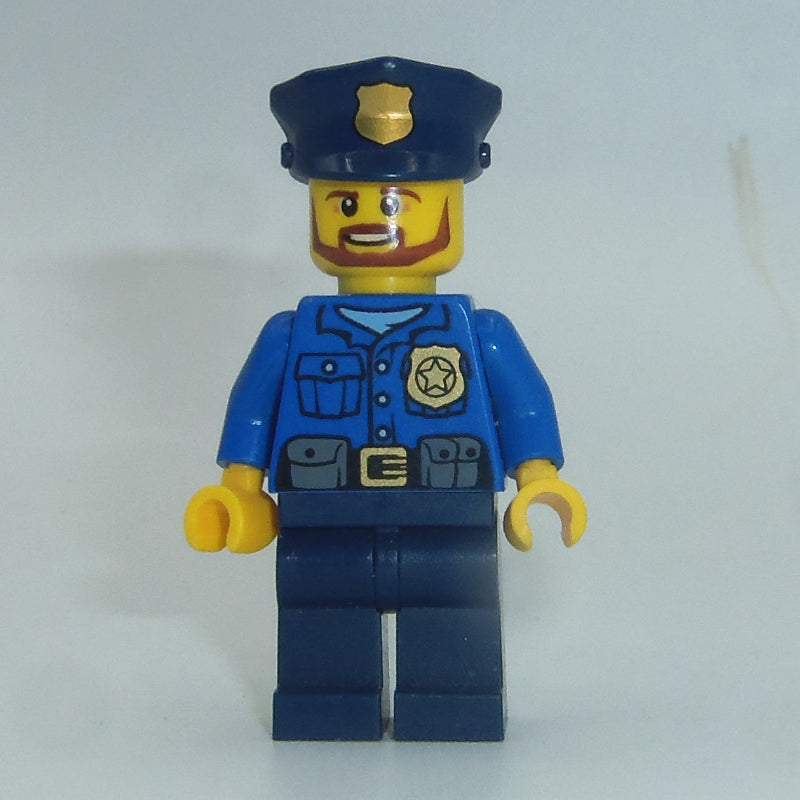 fig-007863 – Policeman, Blue Shirt with Badge and Pouches, Dark Blue Legs, Dark Blue Police Hat with Badge, Beard
