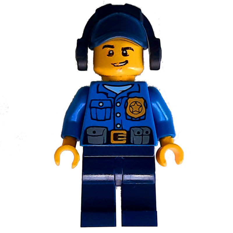 fig-007869 – Policeman, Blue Shirt with Badge and Pouches, Dark Blue Legs, Dark Blue Cap with Ear Defenders