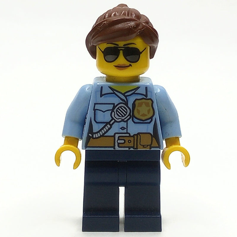 fig-007898 – Policewoman, Bright Light Blue Shirt with Radio and Badge, Dark Blue Legs, Reddish Brown Hair, Sunglasses
