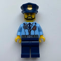 fig-007903 – Policeman, Bright Light Blue Jacket with Zipper, Radio, Badge, and Tie, Dark Blue Legs, Dark Blue Police Hat with Badge, Beard