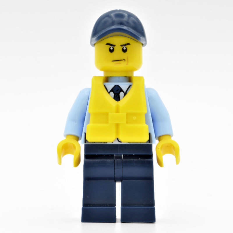 fig-007906 – Policeman, Bright Light Blue Jacket with Zipper, Radio, Badge, and Tie, Dark Blue Legs, Dark Blue Cap, Yellow Life Vest