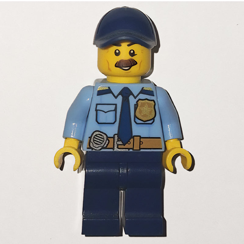 fig-007913 – Policeman, Bright Light Blue Shirt with Dark Blue Tie, Badge, and Radio on Belt, Dark Blue Cap, Moustache