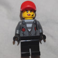 fig-007948 – Criminal, Woman, Open Dark Bluish Gray Jacket with Zipper over Prison Shirt, Red Cap with Hair