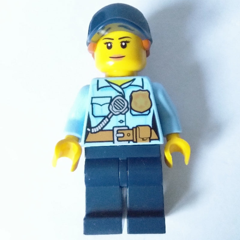 fig-007975 – Policewoman, Bright Light Blue Shirt with Radio and Badge, Dark Blue Legs, Dark Blue Cap with Hair