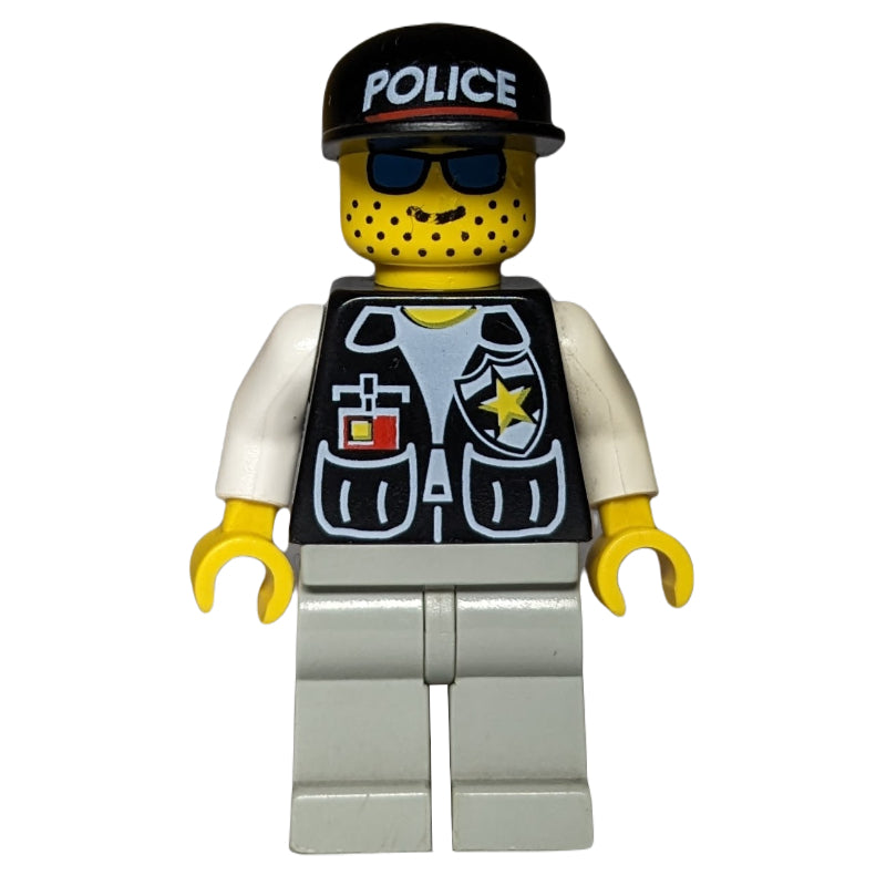 fig-007989 – Policeman, Black Vest with Badge and Pockets, Light Gray Legs, Black Cap with 'POLICE', Blue Sunglasses