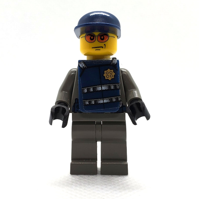 fig-008004 – Security Guard, Dark Gray Shirt with Badge, Dark Blue Cap, Dark Blue Vest, Orange Sunglasses
