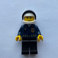 fig-008009 – Policeman, Dark Blue Shirt with Radio and Badge, Black Legs, White Helmet with Visor