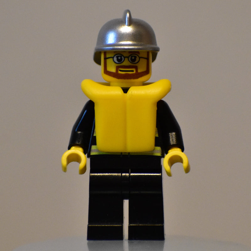 fig-008042 – Fireman, Black Fire Jacket with Reflective Stripes, Radio, and Badge, Silver Helmet, Yellow Life Vest 2610, Beard and Glasses