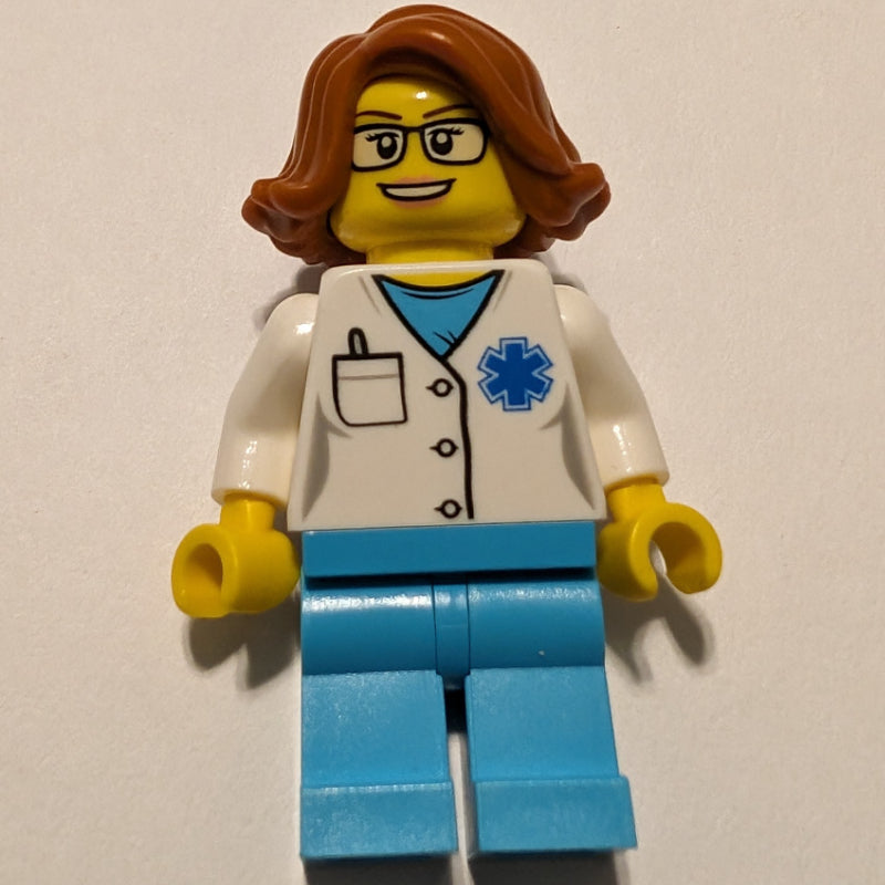 fig-008183 – Doctor, Woman, White Shirt over Medium Azure Scrubs with Star of Life and Pocket, Dark Orange Hair, Glasses