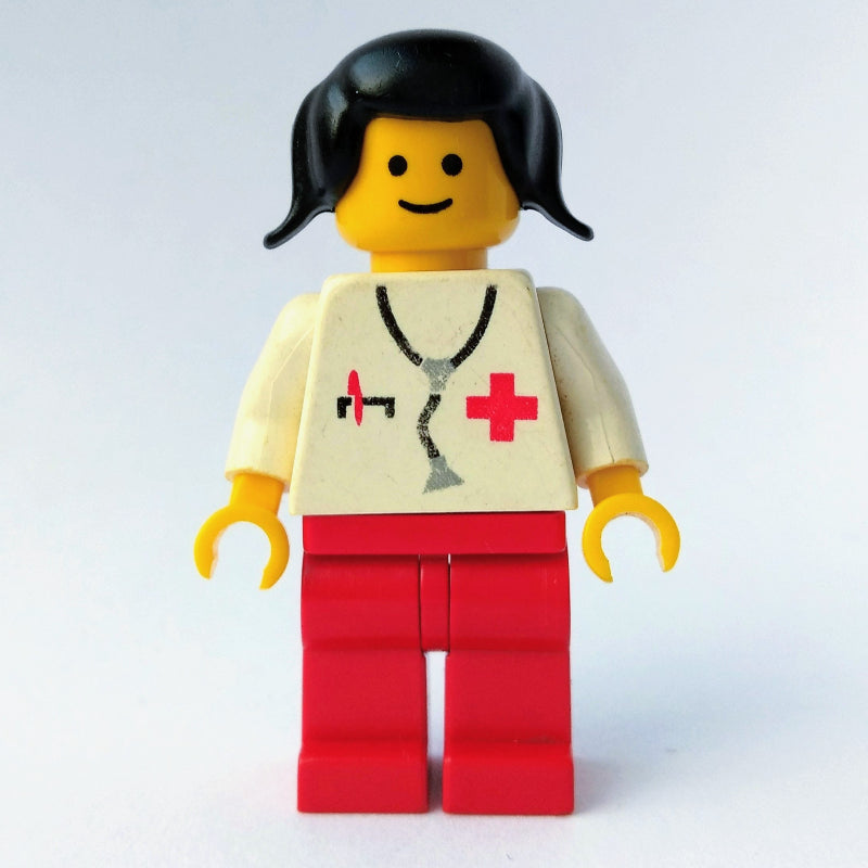 fig-008214 – Doctor, Woman, White Torso with Stethoscope and Red Cross, Red Legs, Black Hair (3626a Head)
