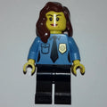 fig-008227 – Policewoman, Medium Blue Shirt with Tie and Badge, Black Legs, Reddish Brown Hair