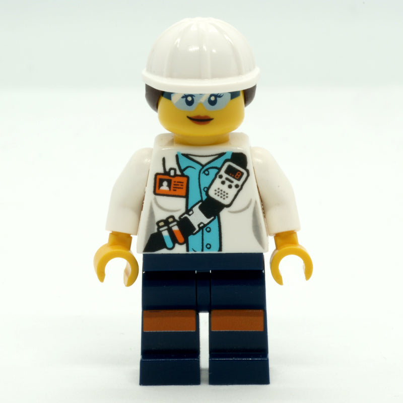 fig-008285 – Miner, Woman, Open White Jacket with Shoulder Belt and ID Badge, White Hard Hat with Hair, Safety Glasses
